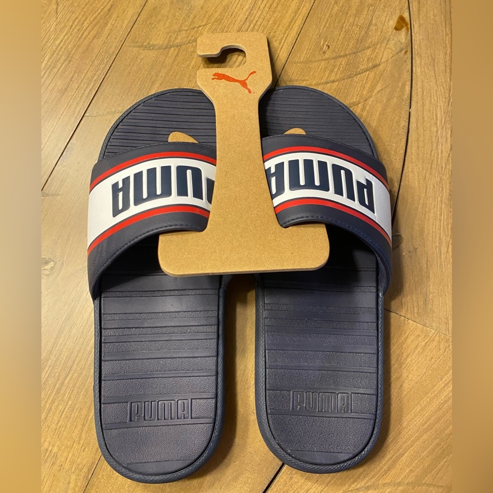 Puma men’s slides.  Brand new.  Size 10.